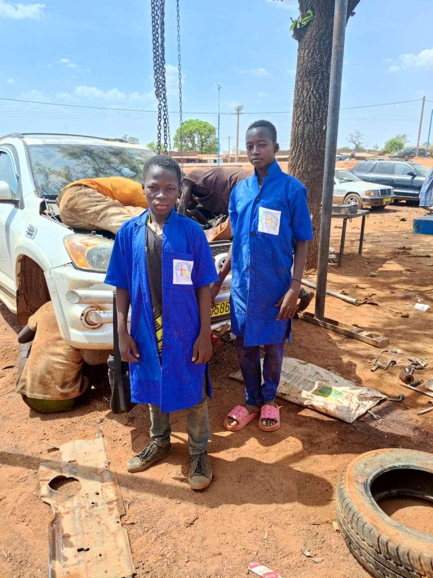 Beneficiaries learning auto mechanics