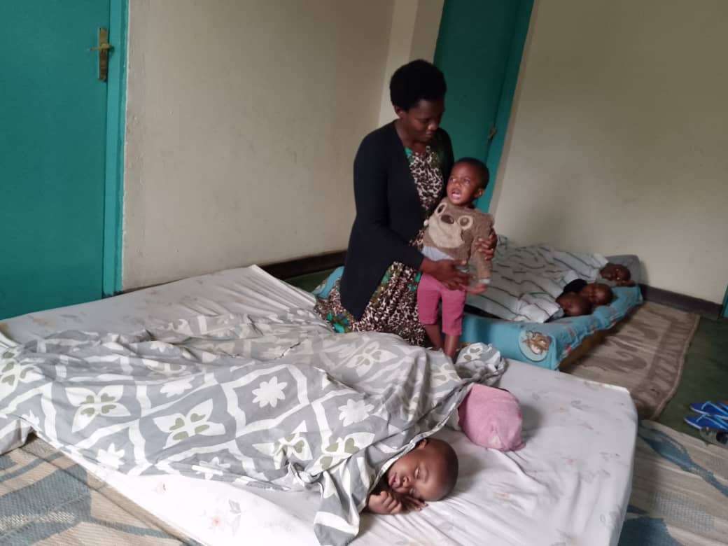 The caregiver is trying to understand what the child wants