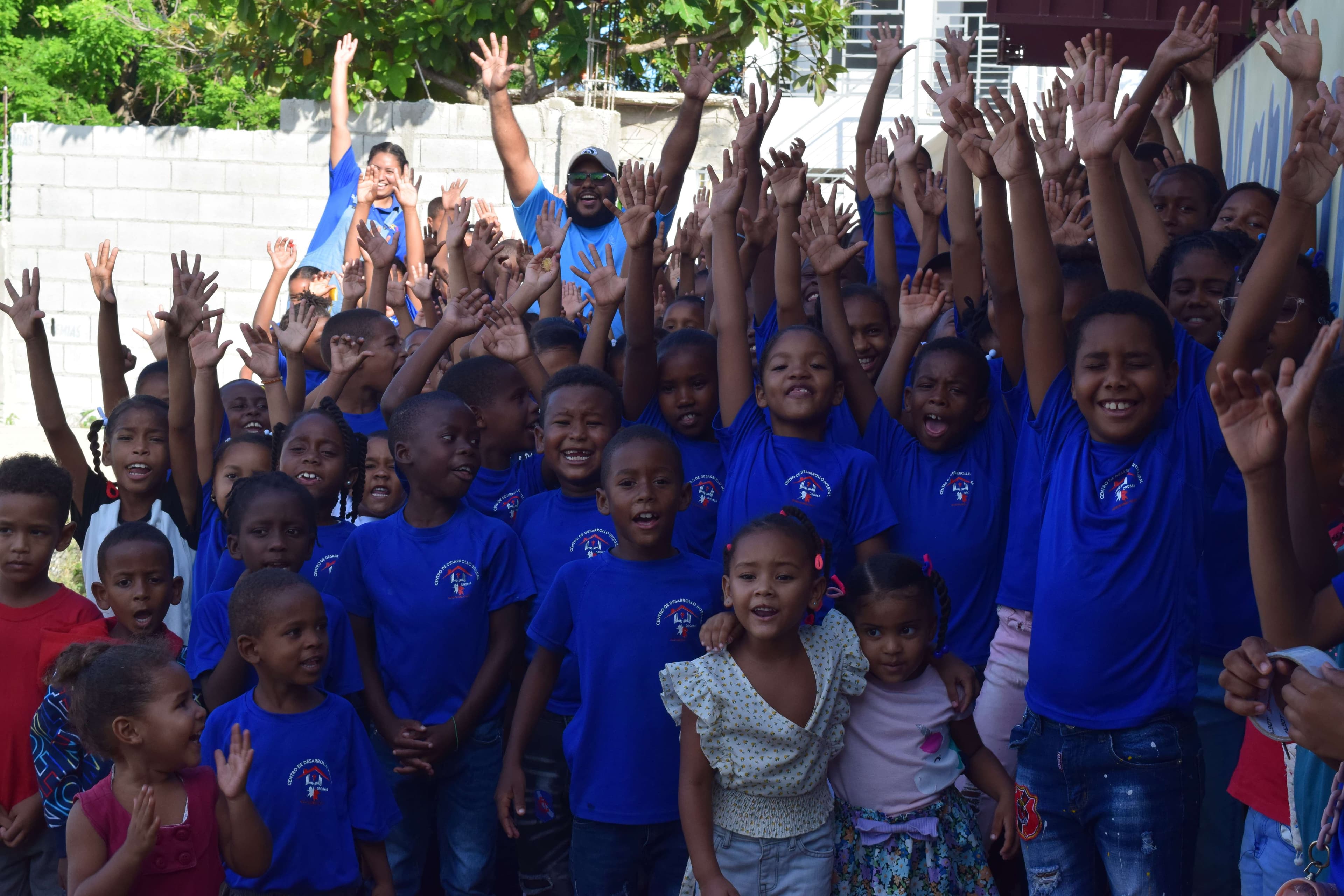 The pastor with a group of participants smiling