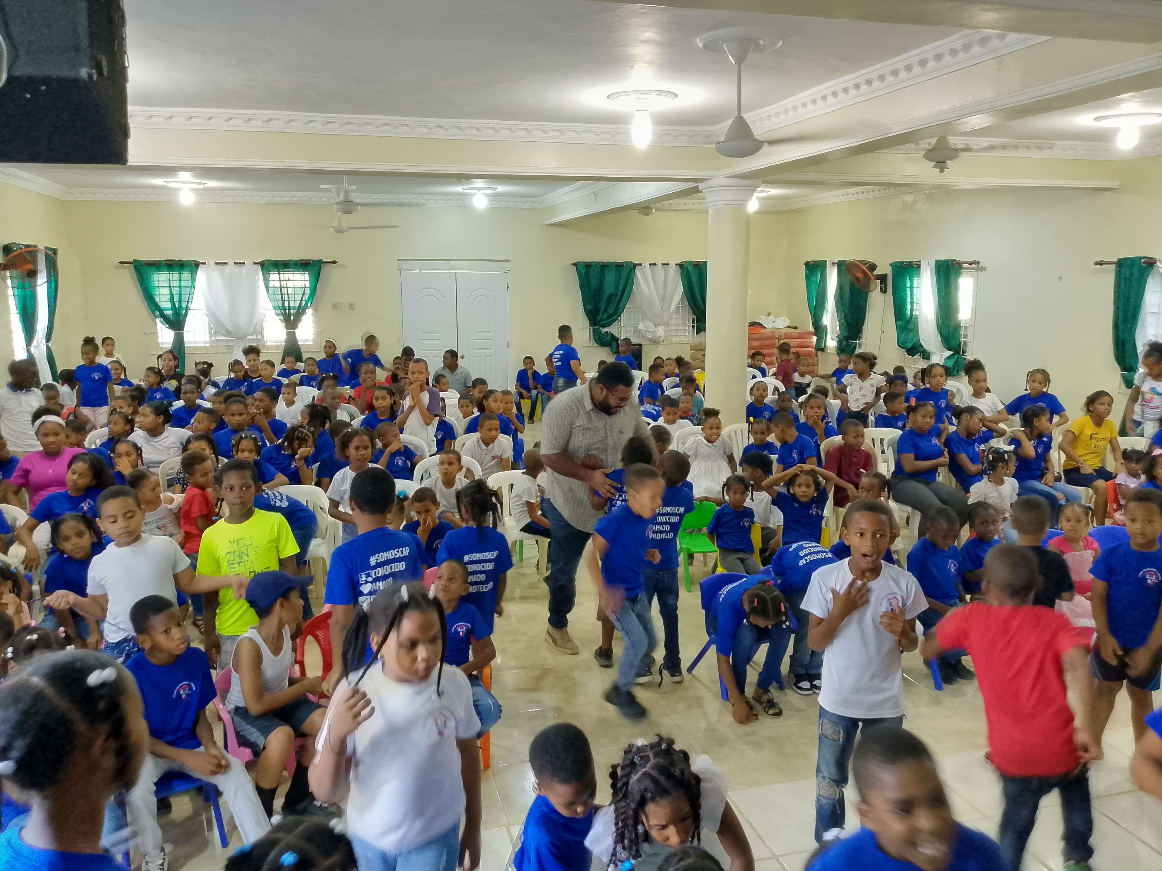 Pastor leading an activity with some of the children