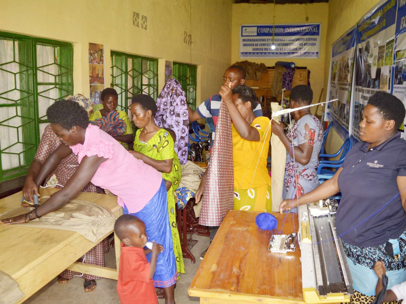 This photo shows the tailors whi ironing the clothes.