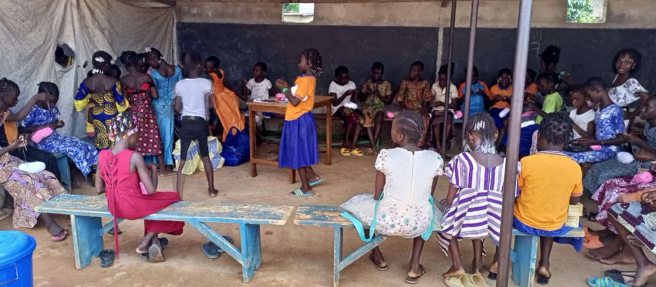 Participants taking a knitting class