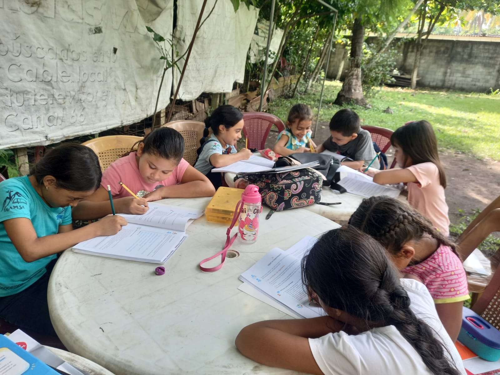 Participants working in the yard due to the heat
