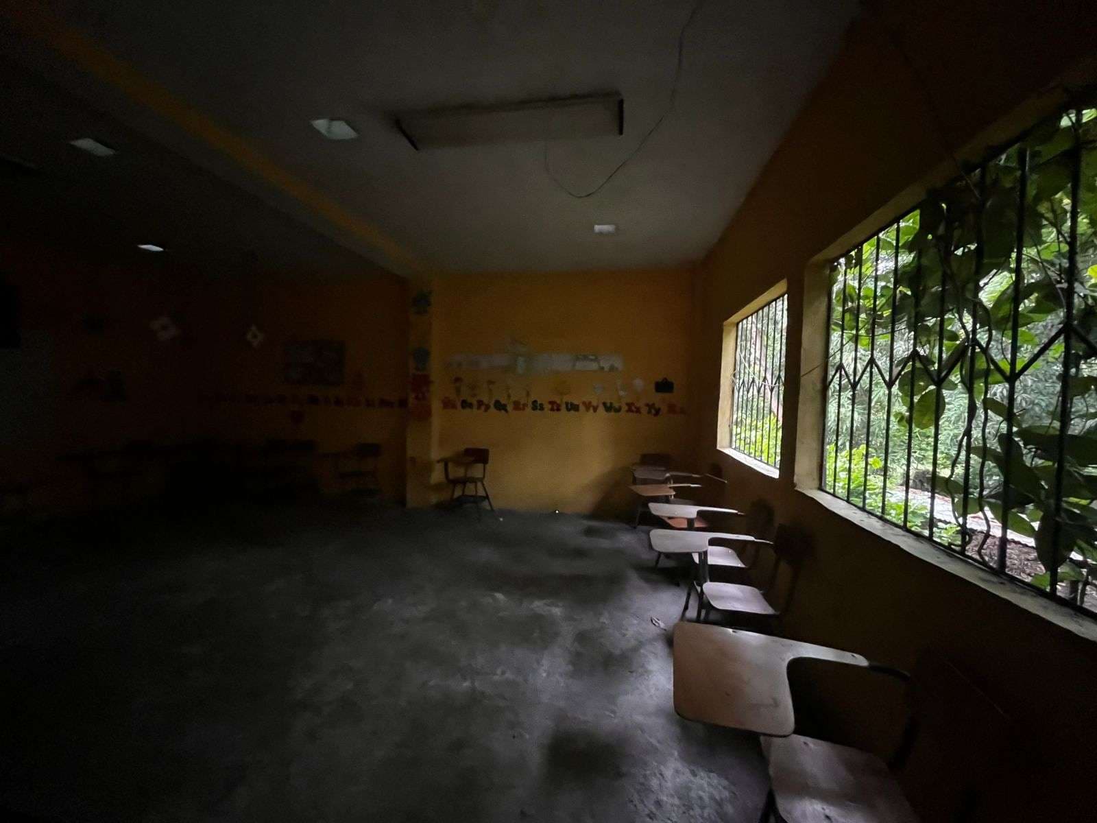 classroom with lights off, they are very dark